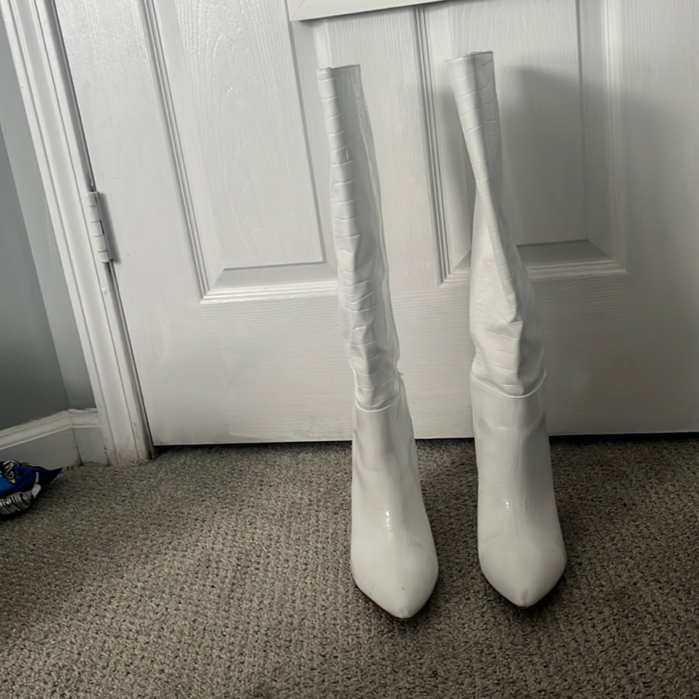 Tall white crocodile print boots